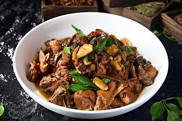 Chinese food: Braised chicken with pine mushrooms and garlic sauce