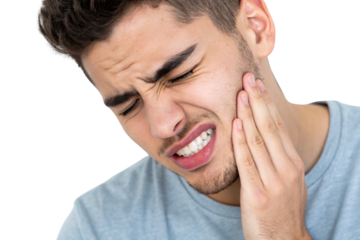 Brown-haired male experiencing dental discomfort touching his face while grimacing in tooth pain, isolated on a transparent background