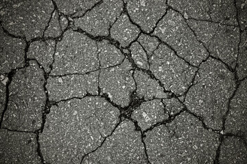 Cracked asphalt with cracks.
