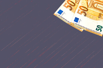 Two 50 euro banknotes on brown fabric.Money,bonus,deposit