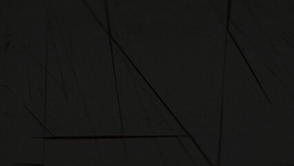 Dark knife scratched wall background. Black cracked smoooth texture background