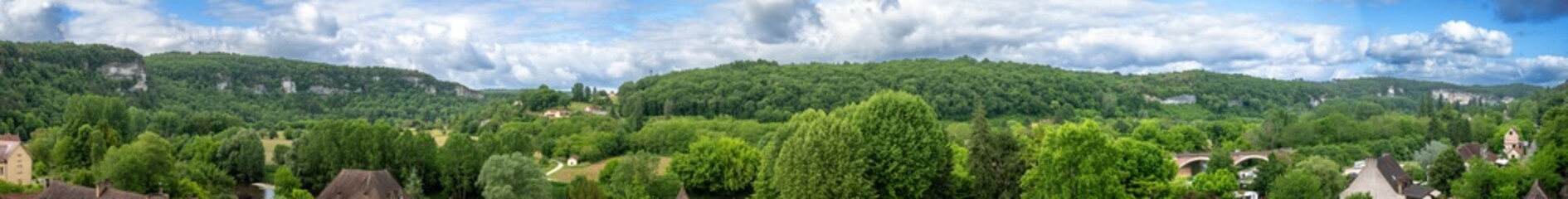 Panoramic view over the Vezere valley from the terrace under the overhanging cliffs in Les Eyzies, France