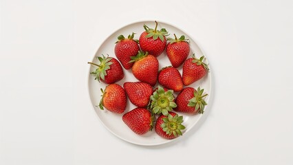Fresh strawberries arranged on a white plate.