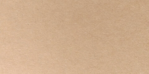 Recycled craft paper textured background in antique brown color. Cardboard sheet texture background