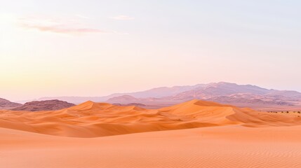 Naklejka premium A golden hour scene of vast sand dunes under a soft gradient sky, creating an elegant backdrop for commercial posters with ample copy space