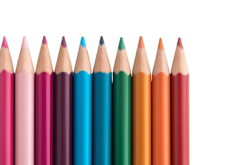 A row of sharpened colored pencils in various hues arranged vertically against a black background.