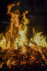 Fire flames on black background, Blaze fire flame texture background, Beautifully, the fire is burning, Fire flames with wood and cow dung bonfire