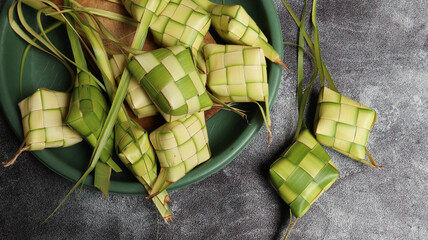 Ketupat (Rice Dumpling) On White Background. Ketupat is a natural rice casing made from young coconut leaves for cooking rice during eid Mubarak, Eid Fitr. top view