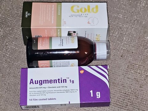 Giza, Egypt, July 2 2025: Augmentin 1g tablets, amoxicillin and clavulanate potassium, clavulanic acid, Beta-lactamase inhibitors and Gold plus cleanser, An advanced feminine hygiene cleanser