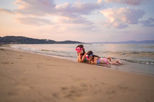 Enjoying a peaceful day at the beach with family and laughter - Powered by Adobe