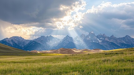 Fototapeta premium Sun rays breaking through stormy clouds over rugged sand dunes, embodying resilience and hope