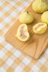 Fresh Yellow Figs on Wooden Board