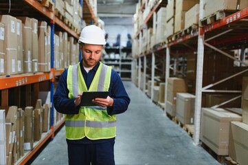 Shipment manager verifying all merchandise pallets in depot, providing merchandise distribution for...