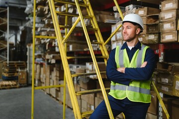 portrait of a smiling young warehouse worker working in a cash and carry wholesale store