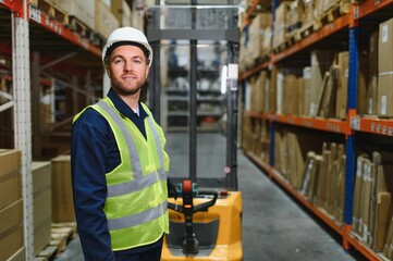 Man Driving Fork Lift Truck In Warehouse