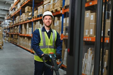 Storehouse manager supervising the lift truck operator