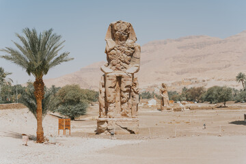 Colossi of memnon representing pharaoh amenhotep iii guarding mortuary temple of amenhotep iii