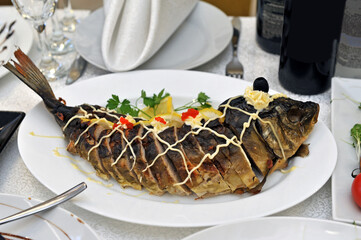 Stuffed carp on the festive table.