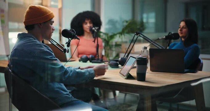Podcast, tablet or talkshow with people in studio together for conversation or discussion. App, interview and social media with influencer team on radio for journalism, production or streaming