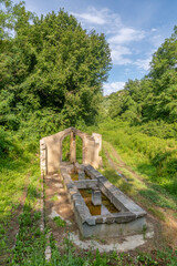The 19th century Castagni fountain, old wash houses where housewives washed baskets of clothes, Fauglia, Pisa, Italy