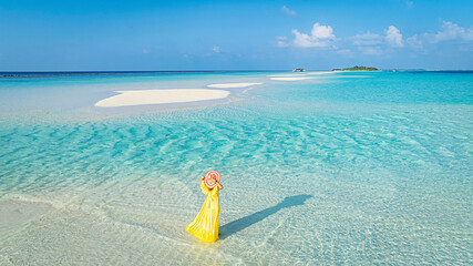 Happy moment freedom lifestyle Relaxation as fresh of summer with young woman in yellow dress  on the beach