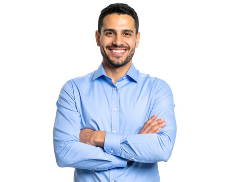 A confident man in a light blue dress shirt smiles with arms crossed, projecting friendliness and professionalism.