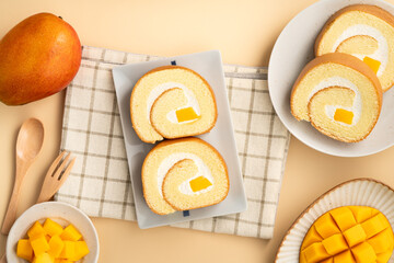 Delicious mango cream Swiss roll cake on plate