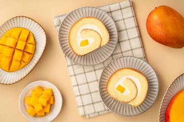 Delicious mango cream Swiss roll cake on plate