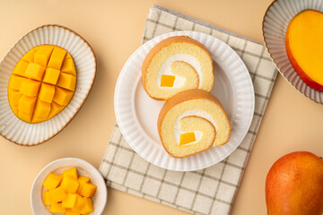 Delicious mango cream Swiss roll cake on plate