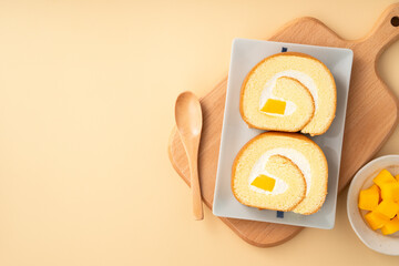 Delicious mango cream Swiss roll cake on plate