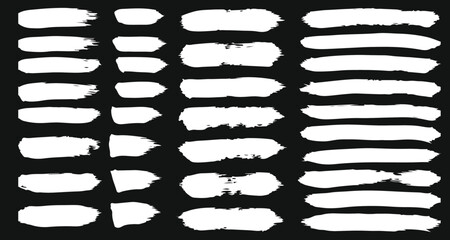 Brushstroke Texture and Pattern: a collection of brushstroke creating texture and pattern on dark background.