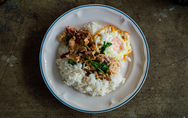 Thai Basil Stir-Fry with Fried Egg on Rice – Authentic Street Food Top View