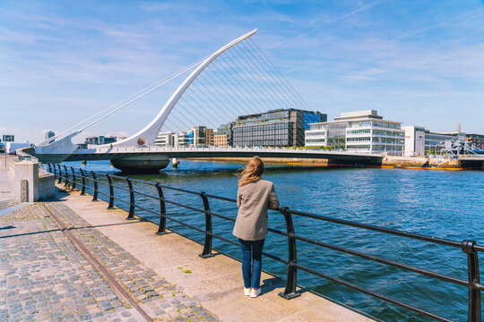 Woman looking at Samuel Beckett's bridge in Dublin Ireland