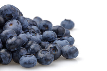 A bunch of blueberries isolated on white background. Selective focus.
