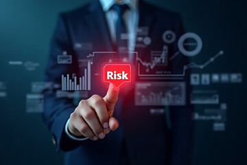 A businessman presses a glowing red Risk button on a futuristic digital dashboard displaying financial data and charts