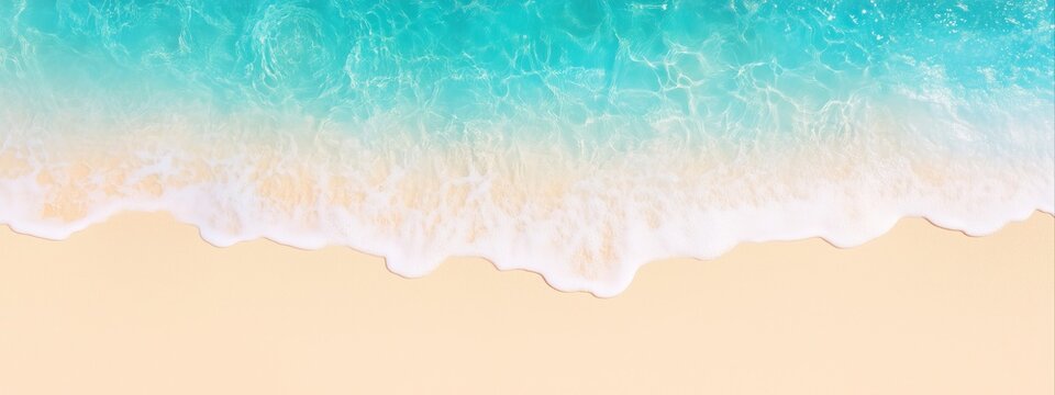 Beach shoreline with turquoise ocean waves washing onto yellow sand viewed from above. Aerial beach image for banner with copy space. Summer vacation and tropical paradise concept.