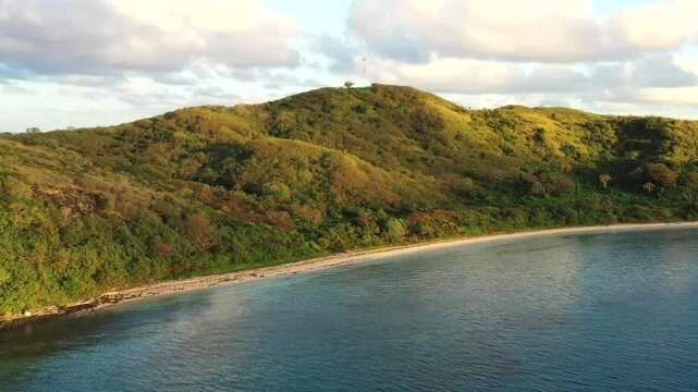 Remote Tokoriki tourism resort island in Fiji on Pacific ocean &ndash; aerial sunrise view.
