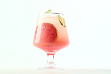 Peach sparkling water filled with ice cubes to cool you down