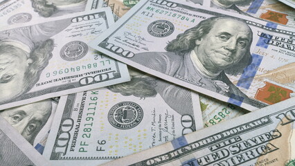 A closeup view showcasing Various U.S. Dollar Bills neatly arranged on a Table surface