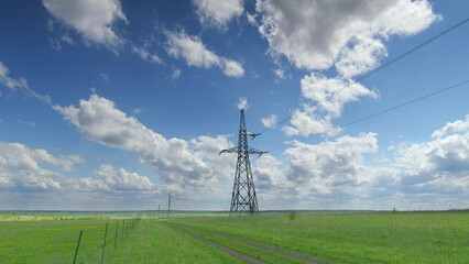 Strikingly Beautiful Power Lines Stand Out Against a Lush and Vibrant Green Landscape Time lapse.