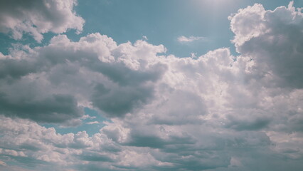 A Beautiful Cloudy Sky with Sunlight Peeking Through the Clouds, Creating a Stunning Scene Time lapse.