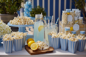 Blue Themed Party Snack Table with Popcorn and Lemons