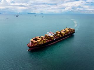 logistic cargo container ship sailing in sea to import export goods and distributing products to...