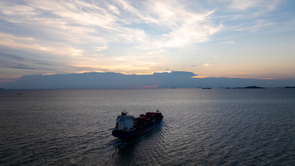 silhouette of shipping logistic cargo container ship sailing in sea to import export goods and...