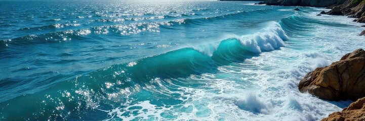 Vast, deep blue ocean waves crashing against a rocky shore, creating a dramatic seascape Sunlight glints off the water's surface, highlighting the texture and power of the ocean , tranquility, spray