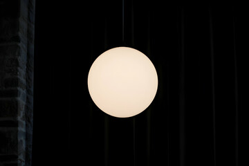 Minimalist White Sphere Pendant Light in Dark Room
