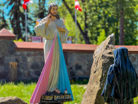 Figure of Merciful Jesus and Saint Sister Faustina in the garden of the Sanctuary of Divine Mercy in Mysliborz in the West Pomeranian Voivodeship in Poland
