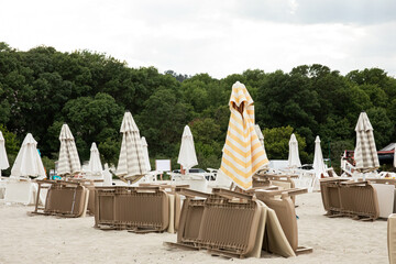 Umbrellas and sun loungers on the beach in summer