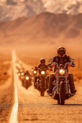 Modern bikers ride along the highway in a large group on a scorching hot day