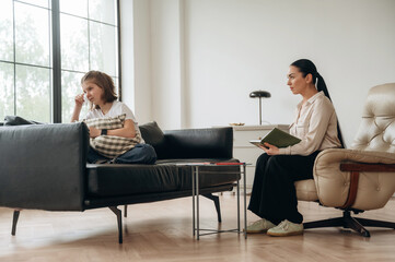 Don't want to talk, feeling depressed. Girl at a psychologist's appointment